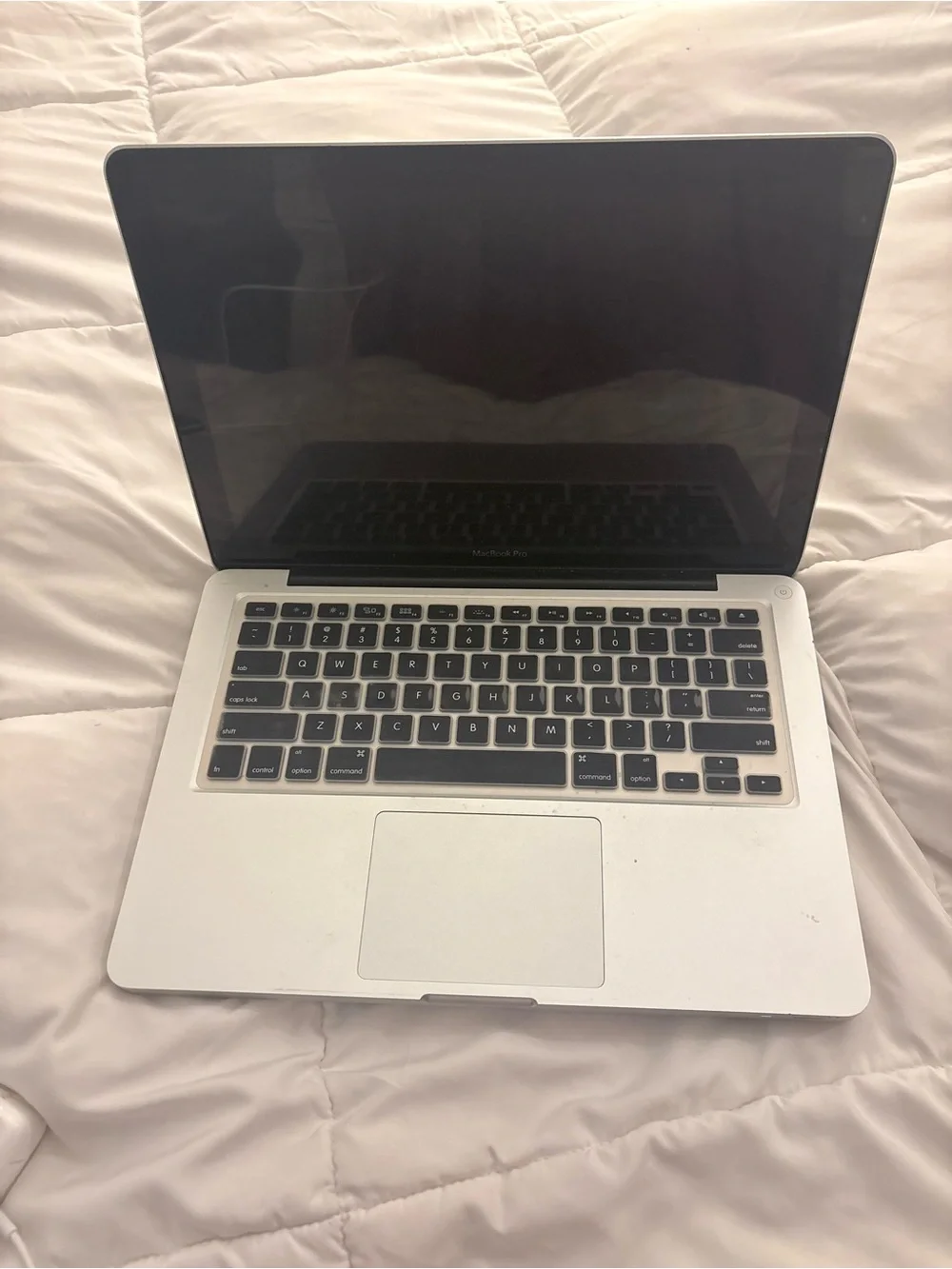 Apple Silver MacBook Pro with Charger and Keyboard Cover